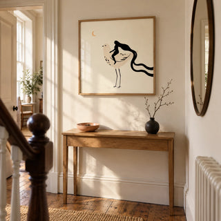 Whimsical Bird Art Print, framed on the wall of a welcoming hallway in a modest Victorian terrace with cream walls and original timber floorboards