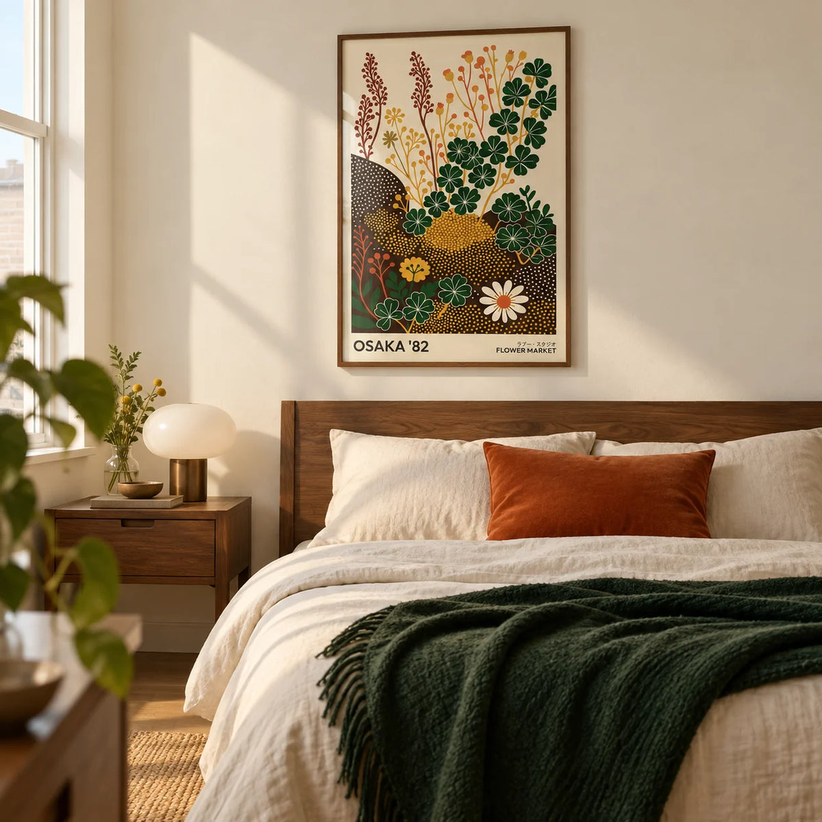 Wildflower Art Prints, framed on the wall of a contemporary bedroom in a UK flat with a pale cream wall and warm wood furniture