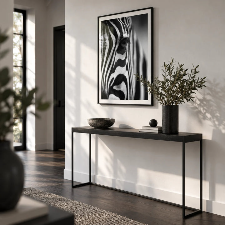 Wildlife Photography Poster, framed on the wall of a monochrome hallway with a white wall and a dark wood floor