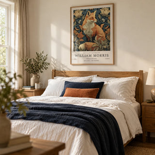 William Morris Fox Print, framed on the wall of a cosy country bedroom with a soft cream wall