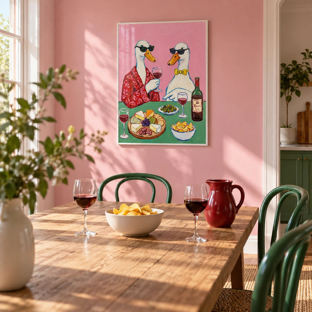 Wine And Cheese Poster, framed on the wall of a bright kitchen-diner with a soft pink wall