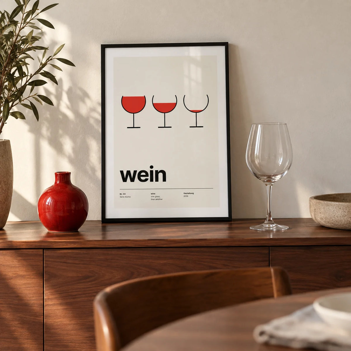 Wine Poster, a small A4 framed print leaning on a walnut sideboard in a dining room