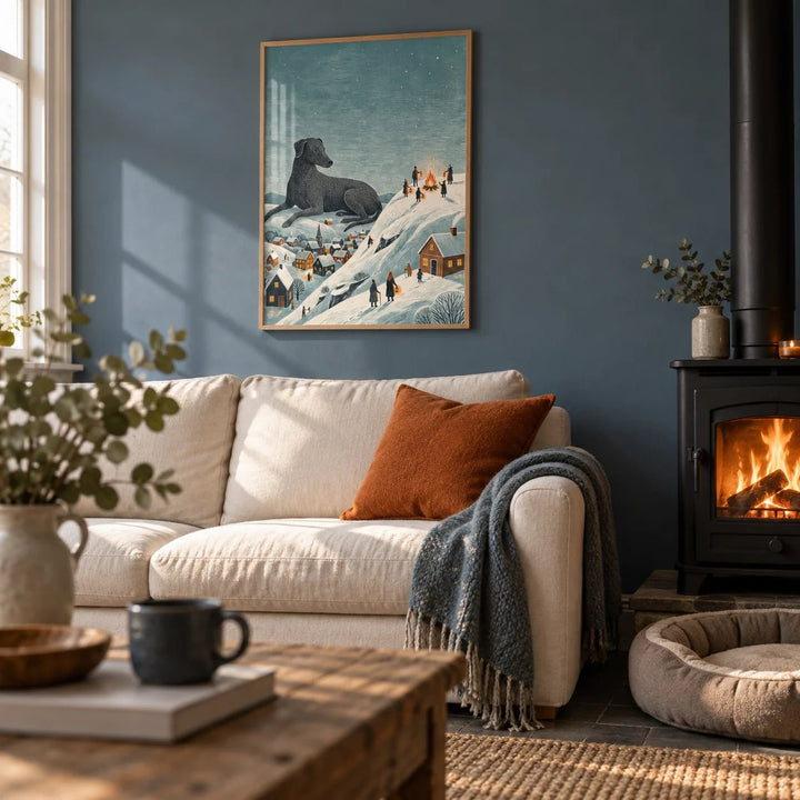 Winter Landscape Wall Art, framed on the wall of a cosy cottage living room with a slate blue painted wall and a black wood burner