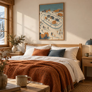 Winter Village Art Print, framed on the wall of a cosy chalet-style bedroom with a cream wall