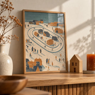 Winter Village Art Print, a small A4 framed print leaning on an oak shelf in a living room