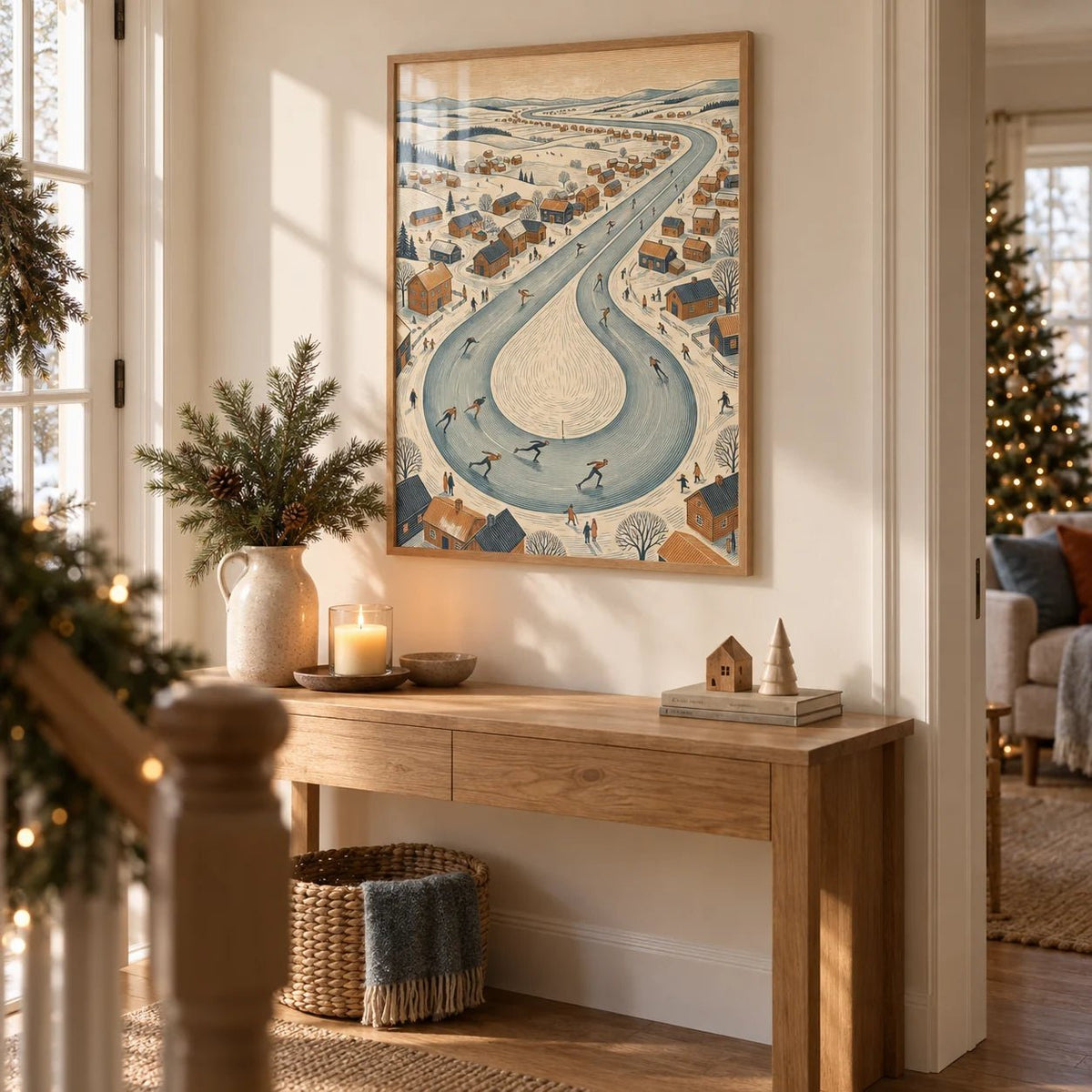 Winter Village Scene, framed on the wall of a hallway at Christmas with a warm white wall