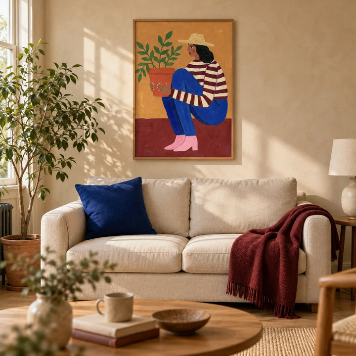 Woman Plant Wall Art, framed on the wall of a warm contemporary living room in a UK terraced home with pale clay plaster walls and oak floorboards