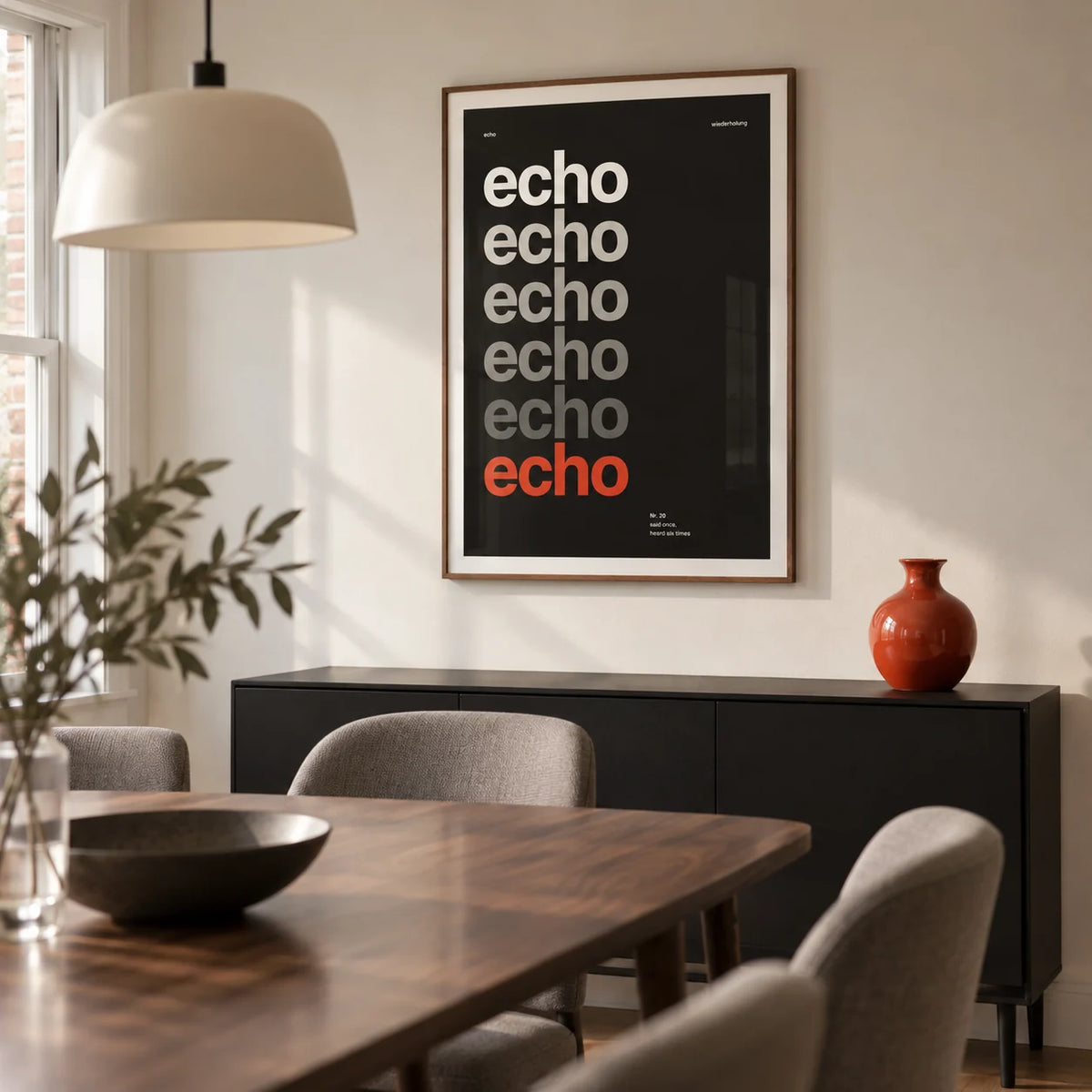 Word Poster, framed on the wall of a compact modern dining room in a UK terraced home with a warm white wall and a walnut dining table