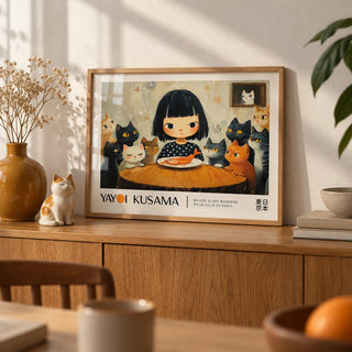Yayoi Kusama Cat Painting, a small A4 framed print leaning on an oak sideboard in a living room
