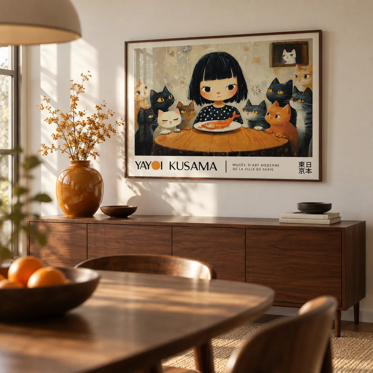 Yayoi Kusama Cat Painting, framed on the wall of a warm dining room with a soft white wall
