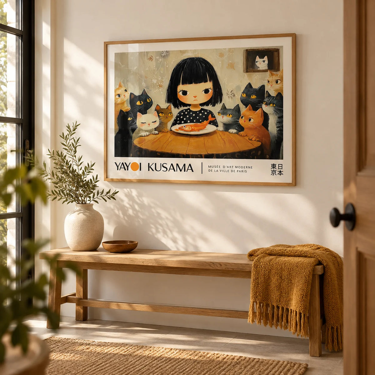 Yayoi Kusama Cat Painting, framed on the wall of a welcoming hallway with a warm white wall