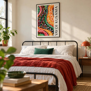Yayoi Kusama Dots, framed on the wall of a modern bedroom with a cream wall