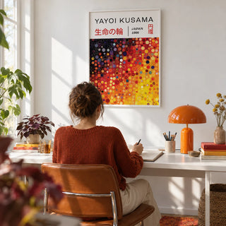 Yayoi Kusama Circles, framed on the wall of a bright home office with a white wall