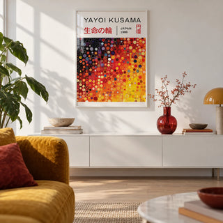 Yayoi Kusama Circles, framed on the wall of a design-led city flat living room with a white wall and a pale oak floor