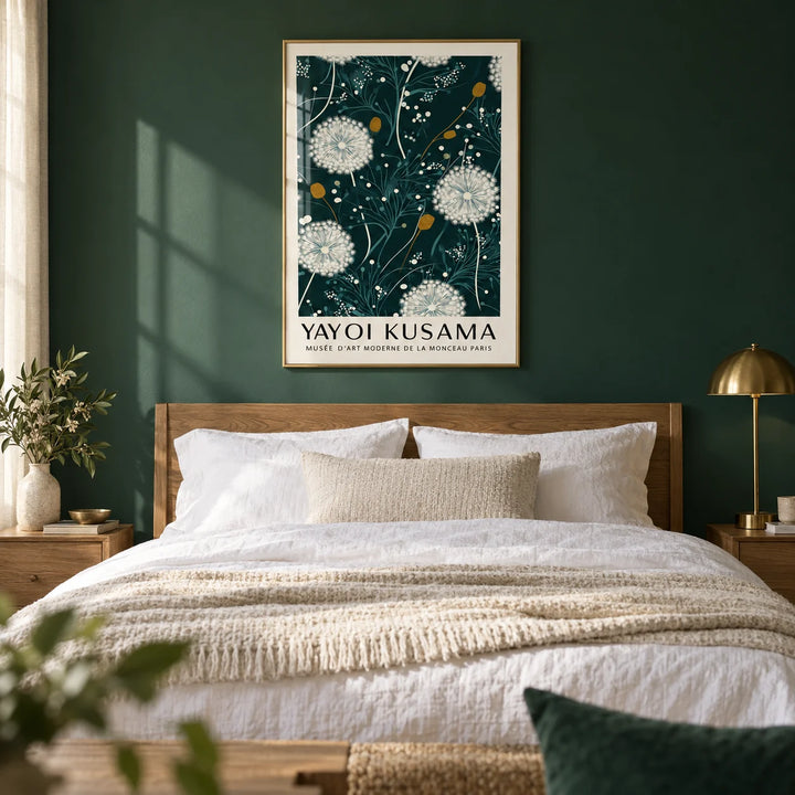 Yayoi Kusama Green Print, framed on the wall of a calm bedroom with a deep forest green painted wall