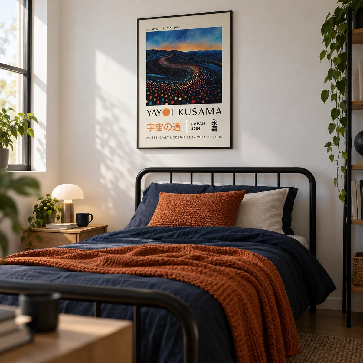 Yayoi Kusama Infinity Room Print, framed on the wall of a modern single bedroom for a young adult (18-25) with a white wall