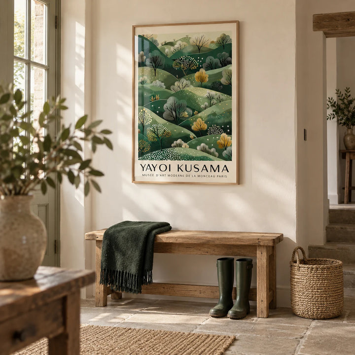 Yayoi Kusama Paintings, framed on the wall of a country hallway with a cream wall and a plain stone floor