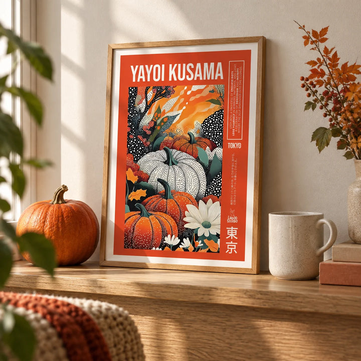 Yayoi Kusama Pumpkin Print, a small A4 framed print leaning on an oak shelf in a living room