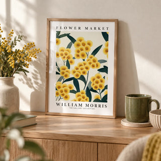 Yellow Flower Wall Art, a small A4 framed print leaning on an oak shelf in a living room