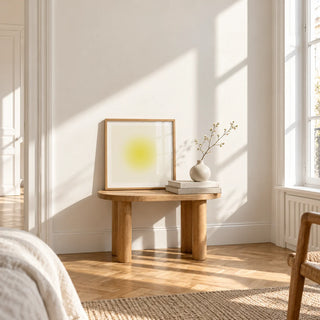 Yellow Wall Art, a small square framed print leaning on a small solid oak side table