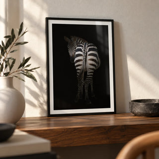 Zebra Art Print, a small A4 framed print leaning on a walnut shelf in a living room