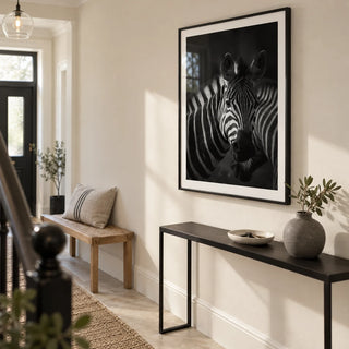Zebra Black White Print, framed on the wall of a crisp entrance hallway in a renovated UK terrace with a warm white wall and pale stone floor