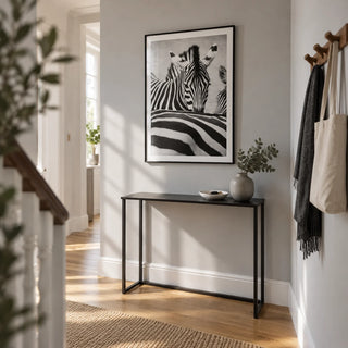 Zebra Black White Wall Art, framed on the wall of a bright narrow hallway in a renovated UK terrace with a pale grey wall and oak floor