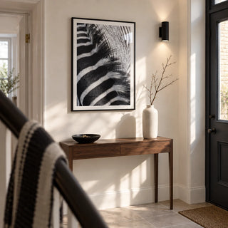 Zebra Stripe Art Print, framed on the wall of a crisp entrance hallway in a renovated UK maisonette with a warm white wall and plain stone floor