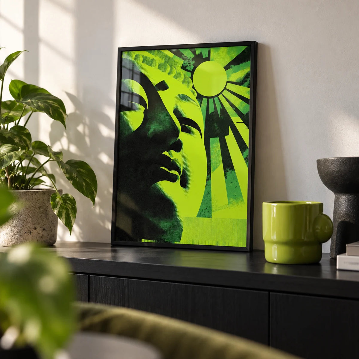 Zen Face Wall Art, a small A4 framed print leaning on a black shelf in a living room
