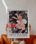 Black and pink wall art featuring coral-toned petals and fine inked details