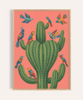 Art coloré représentant un oiseau et un cactus, dans les tons rose et vert, pour décorer les murs d'une chambre à coucher.