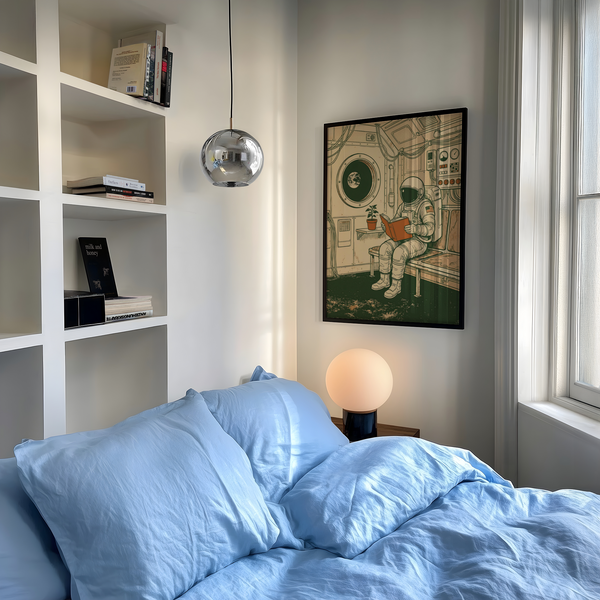 Reading Astronaut Poster featuring astronaut and book, beige, green, and orange, study decor