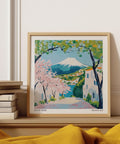Affiche japonaise représentant le mont Fuji avec des cerisiers en fleurs et des maisons à flanc de colline.