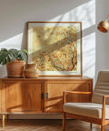 Modern family room wall decor showcasing soft golden hues and detailed branches
