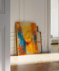 Blue and orange abstract art showing a blurred human silhouette in vibrant warm hues.