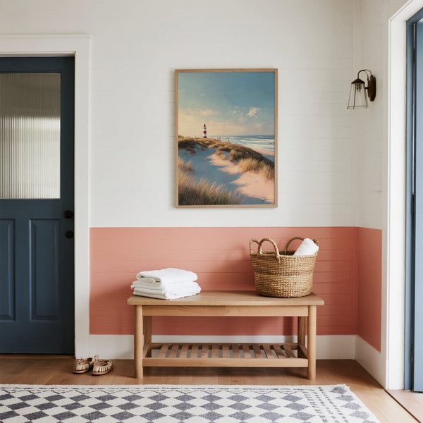 Quadro decorativo con faro a strisce e vista sul mare, perfetto per arredi in stile nautico.