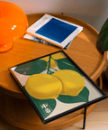 Stampa artistica con frutti agrumati dai colori vivaci verde e giallo per l'angolo colazione